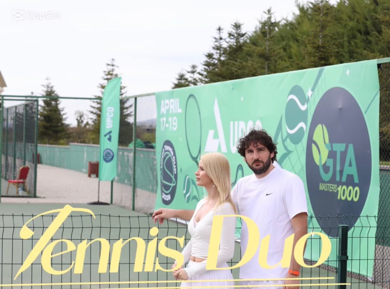 The Tennis Duo team filming courtside